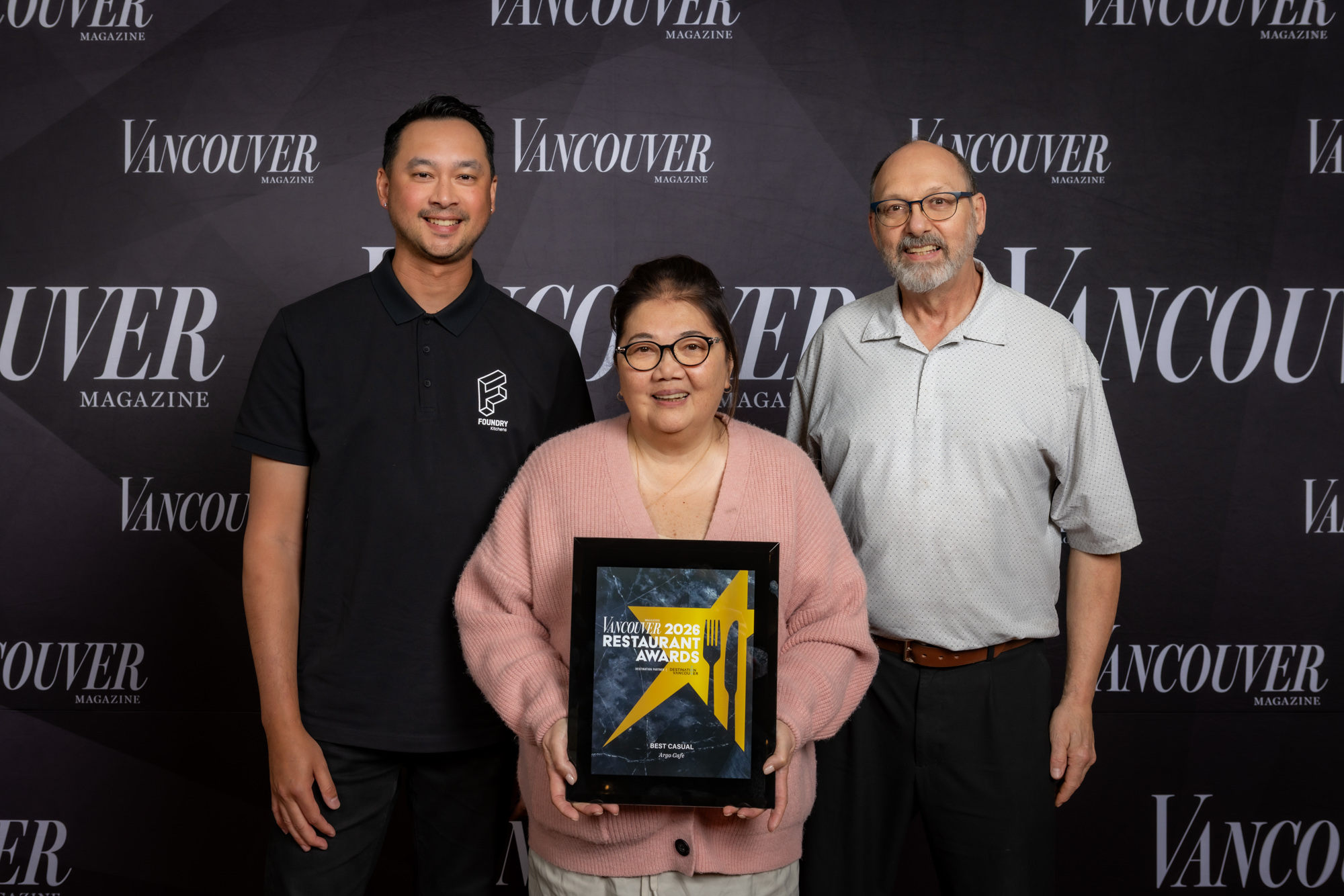 Brian Zuzartee, sales associate at Foundry, presents award to Argo Cafe